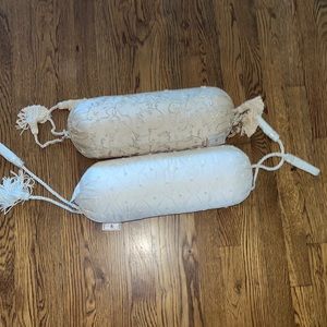 Beige and tan Waterford neck rolls. Beaded